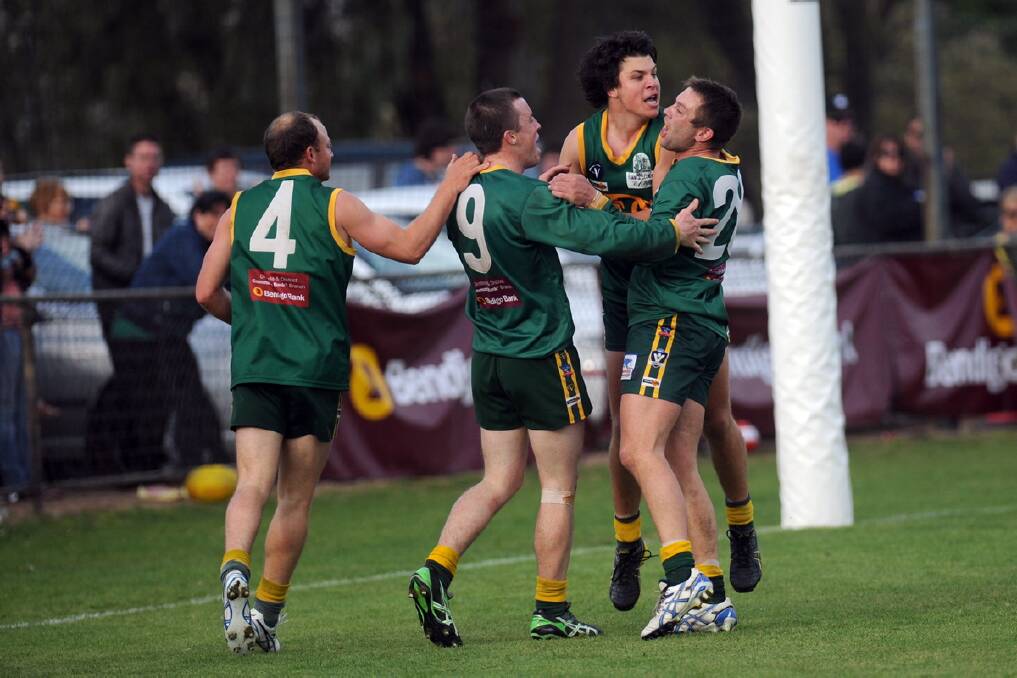 SEPTEMBER 2013: Ash Avery, Hamish Exell, Lachie Exell and Ash Clugston celebrate. Wimmera Football League grand final at Davis Park, Nhill. 