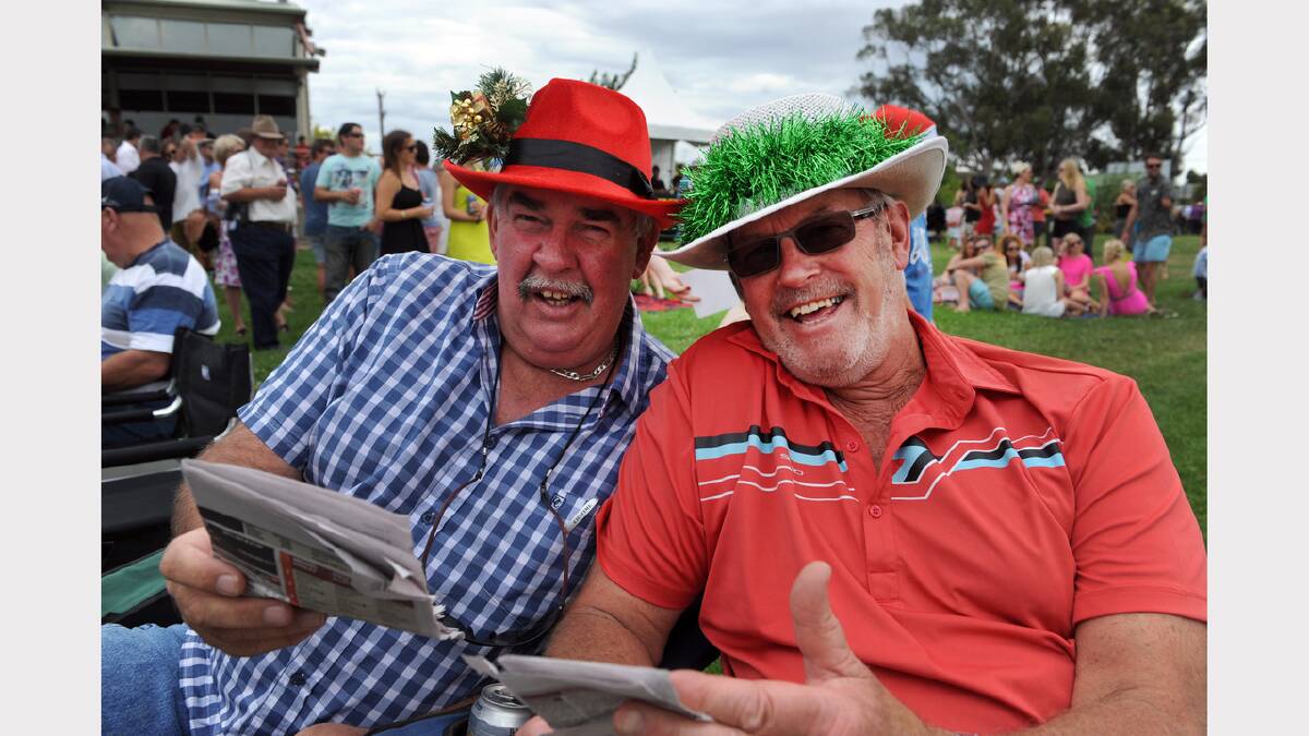 GRAND DAY OUT: Kevin Walsh and Dick Burgess enjoy themselves at Santa Day Races at Horsham Racecourse yesterday. Picture: PAUL CARRACHER
