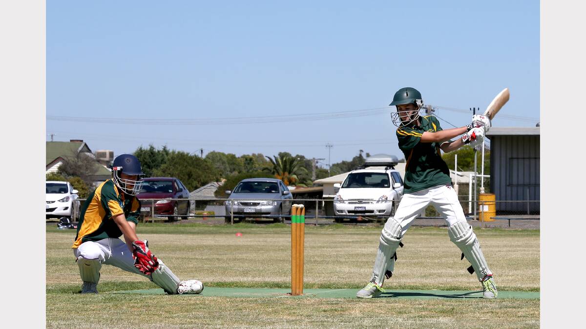 FRESH AIR: West Wimmera batsman Baily Zimmermann, 13, misses with his shot as Wimmera-Mallee Two wicket keeper Jordan Murray, 14, takes the ball cleanly during the Under-14 Country Week competition at Nhill. Picture: THEA PETRASS