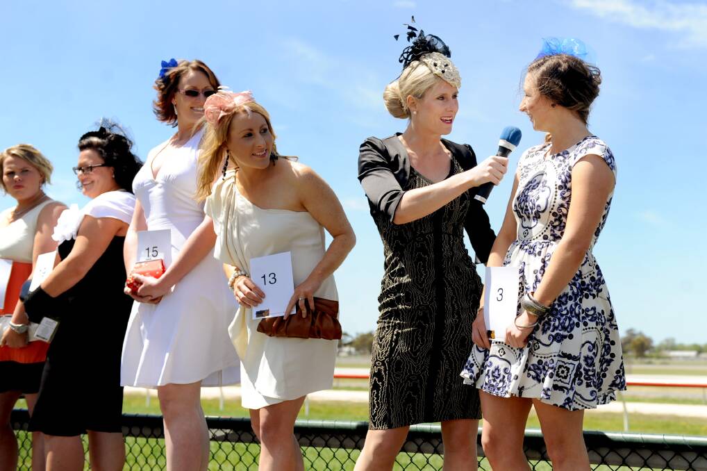 Racing Victoria's Casey Bruce talks to Lady of The Day Fashions on the Field contestant Charlotte McBain. Picture: SAMANTHA CAMARRI 