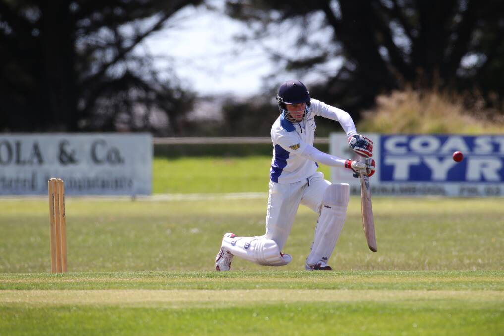 DOWN LOW: Grassmere batsman Dan Clark plays a shot against Warrnambool Gold at Dennington Oval. Picture: DAMIAN WHITE