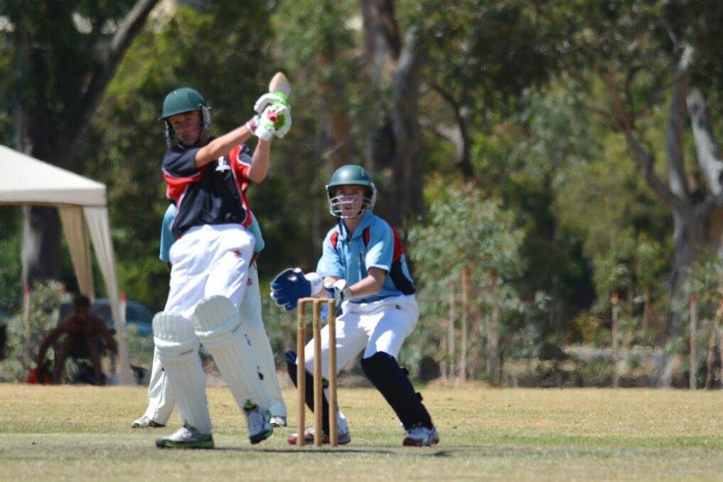 HITTING OUT: Birchip's Joe Reid looks to launch a long ball for the Western Waves at last week's under-14 state cricket championships in Melbourne. Picture: CONTRIBUTED
