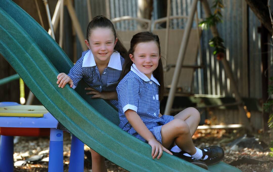 READY TO GO: Murtoa twins Lili and Ruby Wilson, 6, will join hundreds of Wimmera children as they head to primary school for the fi rst time this week. Across Victoria, more than 75,000 preps are set to start school. The girls will attend Our Lady Help of Christians Primary School in Murtoa. Picture: PAUL CARRACHER