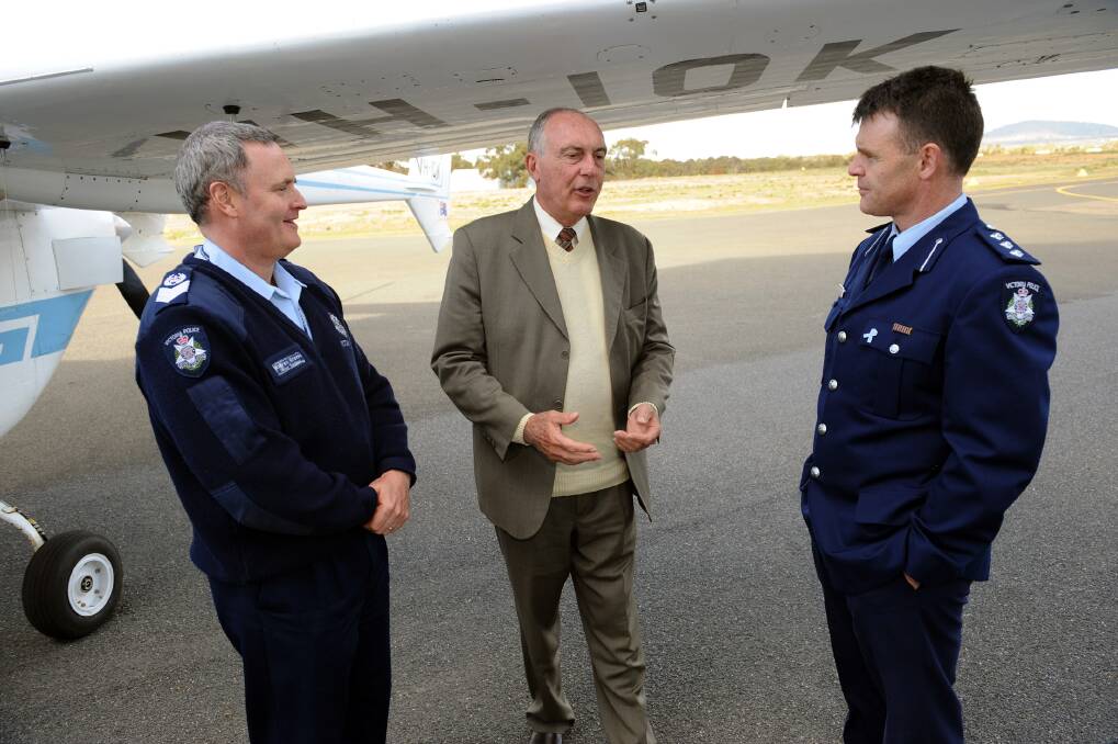 TALK: Nationals leader Warren Truss speaks to Stawell police Senior Sergeant Warren Groves and Inspector Paul Hargreaves at the opening of stage two of the Stawell Aerodrome redevelopment in August last year. Northern Grampians Shire Council is planning more upgrades for the aerodrome. Picture: PAUL CARRACHER