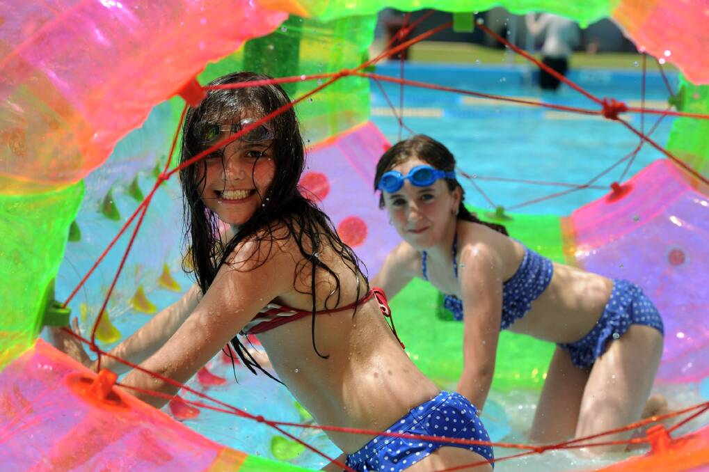 PARTY TIME: Ashley Ellis, 8, and Olivia Howell, 9, at Horsham Aquatic Centre’s pool party. Picture: PAUL CARRACHER