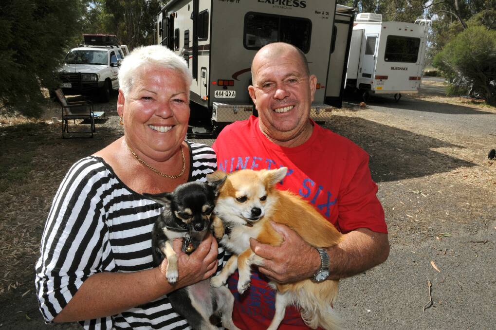 SEASONED TRAVELLERS: Kev and Di Tuohy from Mandurah, WA, with dogs Johnny and Frankie stayed at Horsham Caravan Park for two nights as they travel the country. Pictures: PAUL CARRACHER