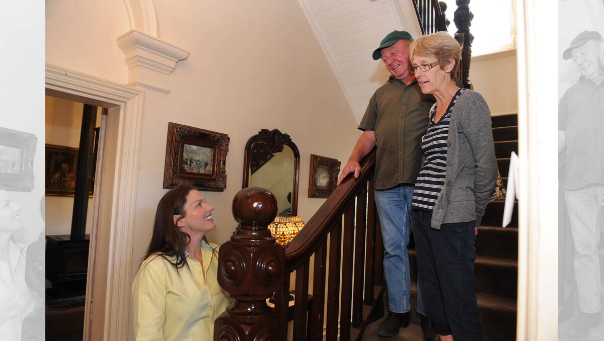 TOUR: Minyip's old post office owner Michelle Brabender shows Robert and Denise Ford of Horsham through the building. Picture: PAUL CARRACHER