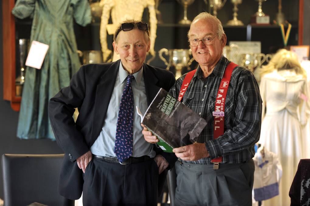 CAUGHT READ HANDED: Rupanyup-based author John Ellen, left, and Neil Langley with ‘The True Story of the Maryvale Murders and the Langley Family Ghost’, written by John about Neil’s aunt. Picture: PAUL CARRACHER
