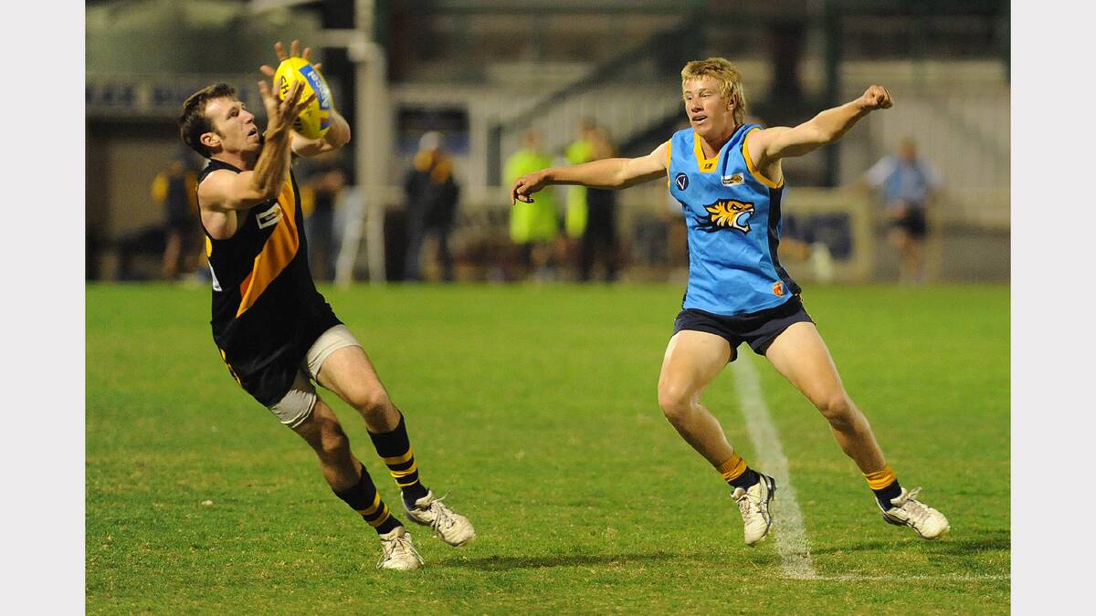 2011: Horsham United's Shannon Argall marks in front of Nhill's Liam Schwarz.