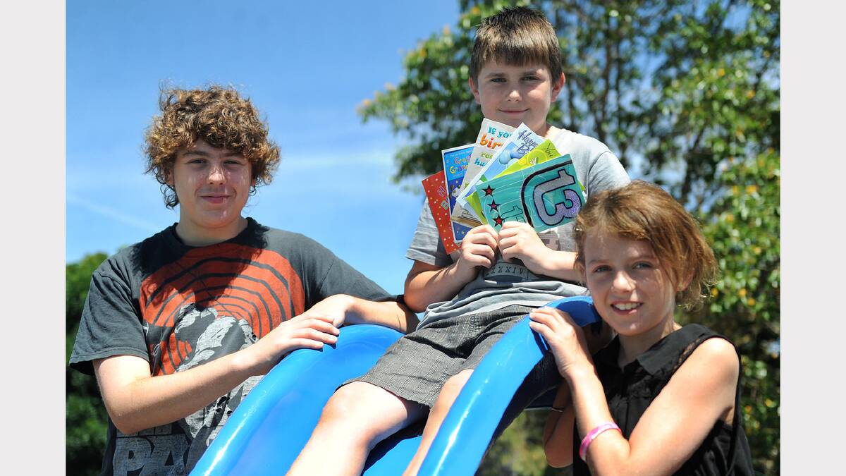 BIRTHDAY BOY: Brenton Hallam, middle, celebrates his 13th birthday yesterday with friend Tom Iredell-Burke, 13, and sister Abby Hallam, 10. Brenton, who featured on the front page of Monday's Mail-Times, said he loved having his birthday on the first of the year. He celebrated with family and friends in Halls Gap yesterday. Picture: AYESHA SEDGMAN