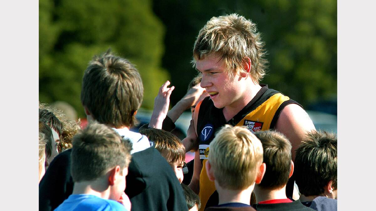 2004: Brad Miller mobbed by excited Digger fans as he becomes the first Horsham United player to notch 100 goals.