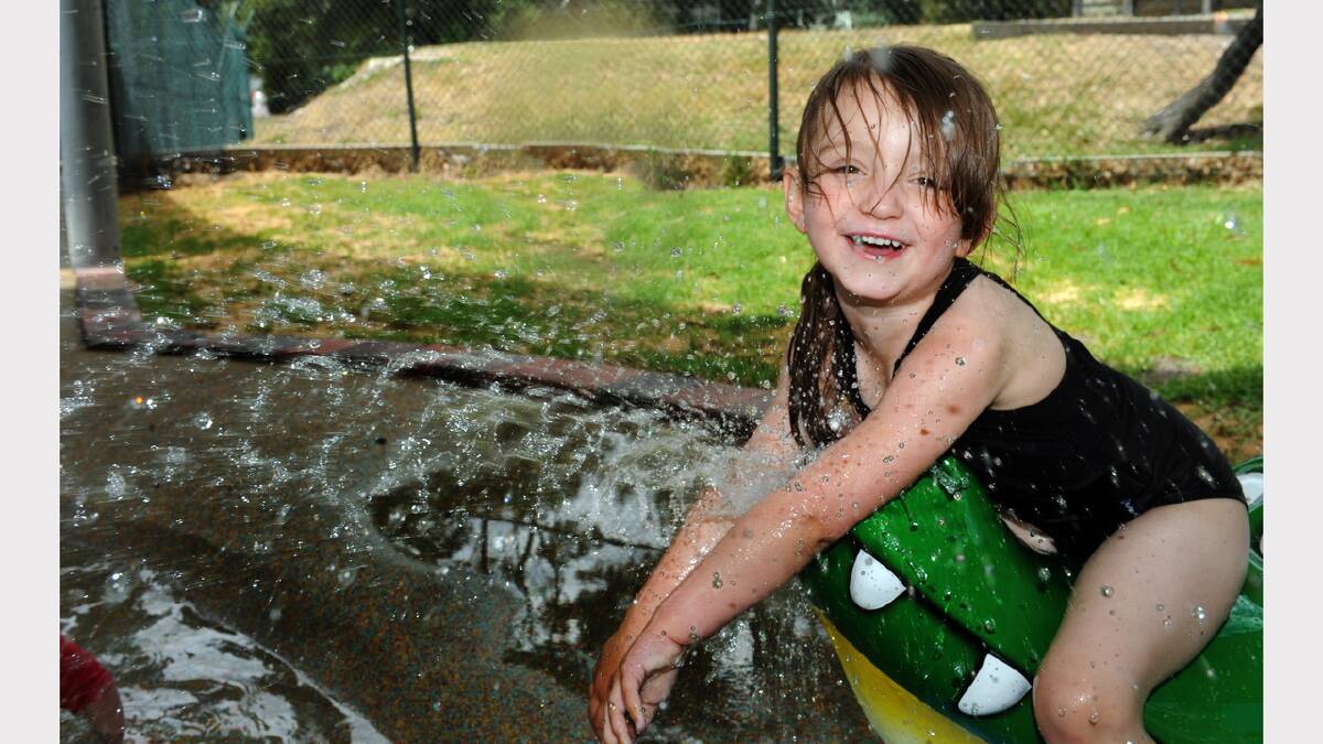 COOLING OFF: Genevieve Bray, 4, enjoys a new children’s splash pad at Halls Gap swimming pool. Pictures: PAUL CARRACHER