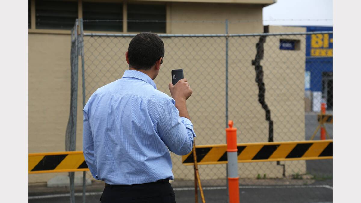SMASHED: The toilet block in the Horsham Town Hall carpark. Police believe a vehicle hit the toilet block and damaged it. Horsham Rural City Council's Peter Kolev inspects the damage. Picture: THEA PETRASS