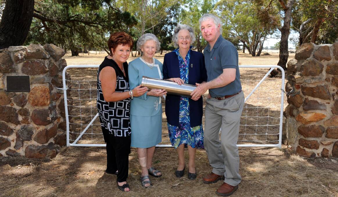 REUNION: Toolondo Recreation Reserve ladies committee president Carmel Officer, long-term Toolondo residents Claire McKenry and Pat Carey and Toolondo Recreation Reserve committee president John Cameron with a time capsule. Past and present Toolondo residents gathered at the weekend for a 25-year reunion. The time capsule will be opened in 2038. Pictures: SAMANTHA CAMARRI