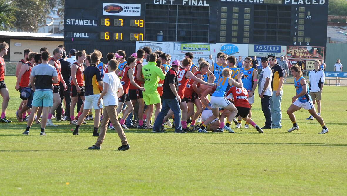 BRAWL: The melee during half time of the Stawell v Nhill game.