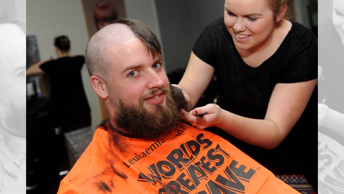 NEW DO: Tegan Kerrins shaves Karl Carman’s head for the World’s Greatest Shave. 