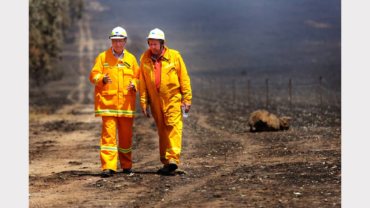 DEVASTATION: Victorian Premier Denis Napthine and Horsham Mayor David Grimble tour Cr Grimble’s Brimpaen property on Saturday after fires swept through the area. Cr Grimble’s house was unscathed but the family lost a large amount of property and stock. Dr Napthine also visited the Horsham Incident Control Centre on Saturday, where he commended emergency services for the way they had managed fires across the Wimmera and Mallee. He returned to the region on Tuesday to visit Halls Gap. He stopped at Brambuk the National Park and Culture Centre and also walked Halls Gap’s main street. Picture: SAMANTHA CAMARRI
