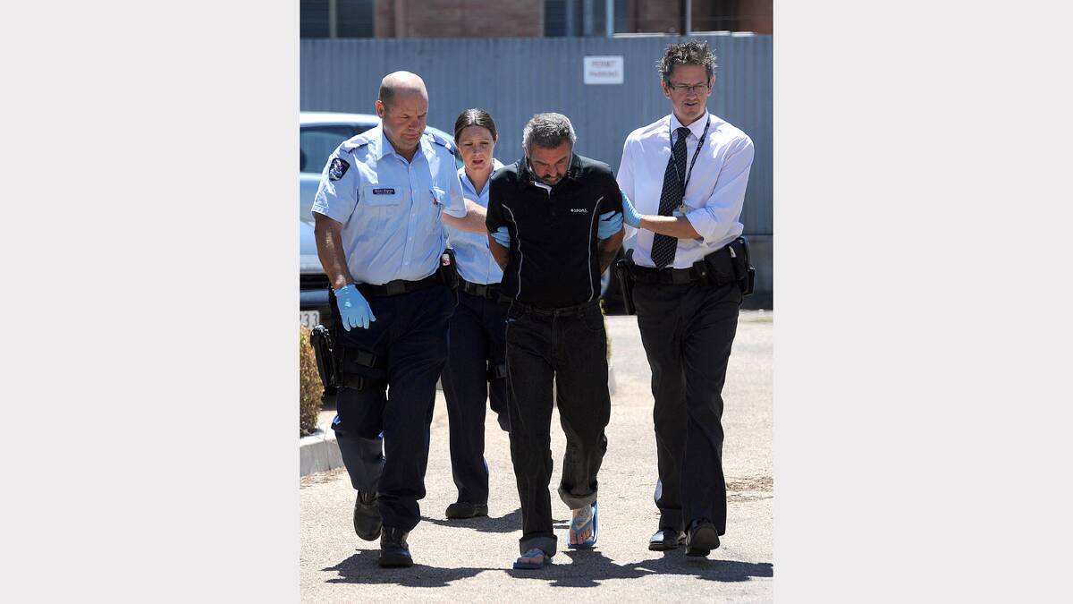 CHARGED: Apsley man Michael Kelly is led into Horsham Magistrate’s Court after he was charged with the murder of Goroke mother Julie-Ann Rogers. Mrs Rogers was shot dead in a Goroke house in February last year. Picture: PAUL CARRACHER