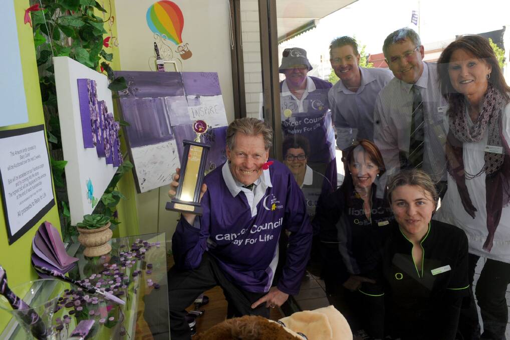WINNER: Des Lardner celebrates his business's win with Relay for Life chairman Kingsley Dalgleish, Wimmera Mail-Times advertising manager Clint King, Horsham Mayor David Grimble and his Jenny, and sitting, staff members Tina Baker, Jenni Sonego and Amy Bellman. Picture: SAMANTHA CAMARRI