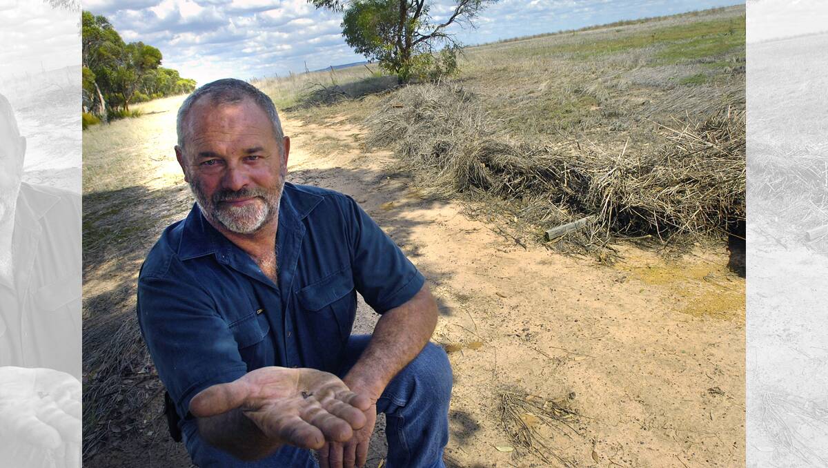 PETITION: Wimmera farmer Bob Mackley with GM canola seeds. A petition against GM has attracted more than 30,000 signatures. Picture: AMY PYSDEN