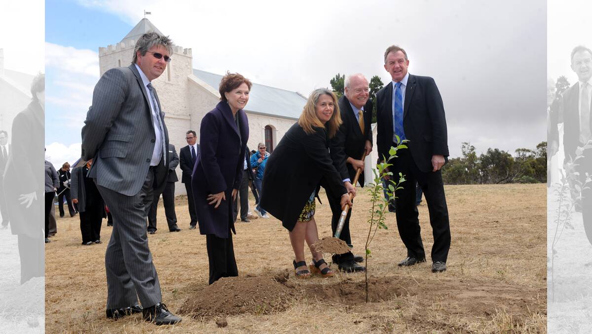 FRESH START: National Trust of Victoria chief executive Martin Purslow, Minister for Aboriginal Affairs Jeanette Powell, Barengi Gadjin Land Council chairwoman Janine Coombs, National Trust of Victoria chairman Graeme Blackman and Member for Lowan Hugh Delahunty plant an apple tree, a gift from the trust, at Thursday's handover at Ebenezer Mission. Picture: SAMANTHA CAMARRI