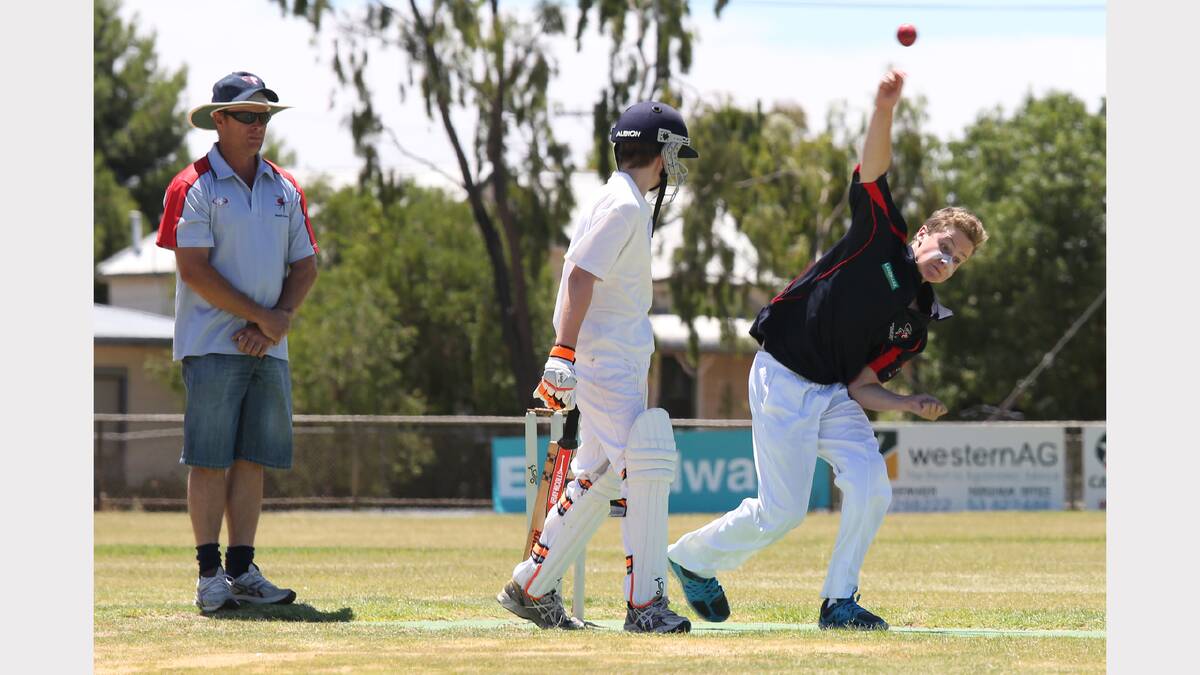 WATCHING ON: Glenn Carroll umpires for Horsham's Zac Hamerston and Nhill's Josh Lees during the Under-14 Country Week competition at Nhill. Picture: THEA PETRASS