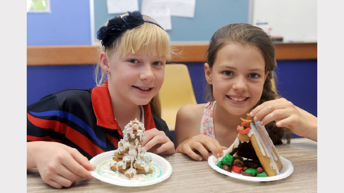 SMILES: Jaclyn Clode, 11, and Ella Brennan, 10, both of Horsham, work on their Christmas treats.
