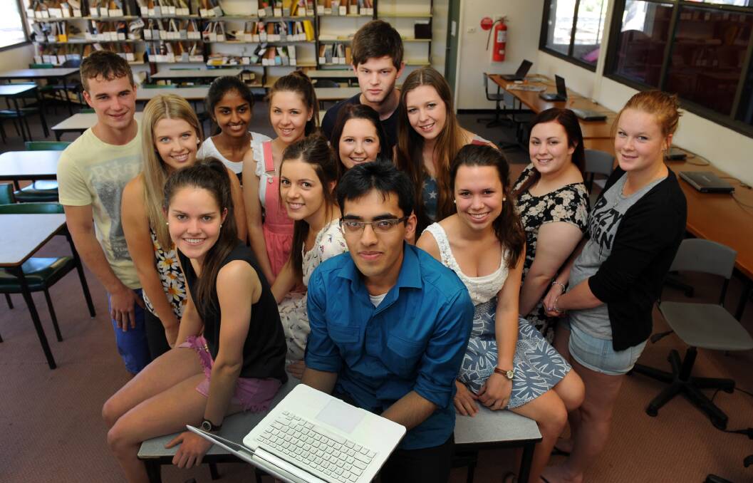 DUX: Horsham College dux Taha Mollah, centre, with fellow VCE students celebrating their results. Picture: PAUL CARRACHER