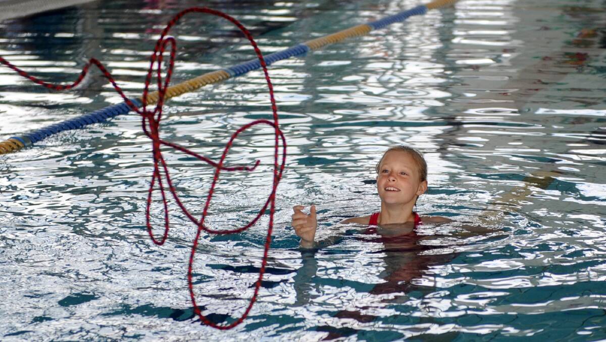 DROWNING PREVENTION: Horsham’s Lucy Heinrich, 9, takes part in a Dolphins swimming group rescue lesson at Horsham Aquatic Centre. Picture: PAUL CARRACHER
