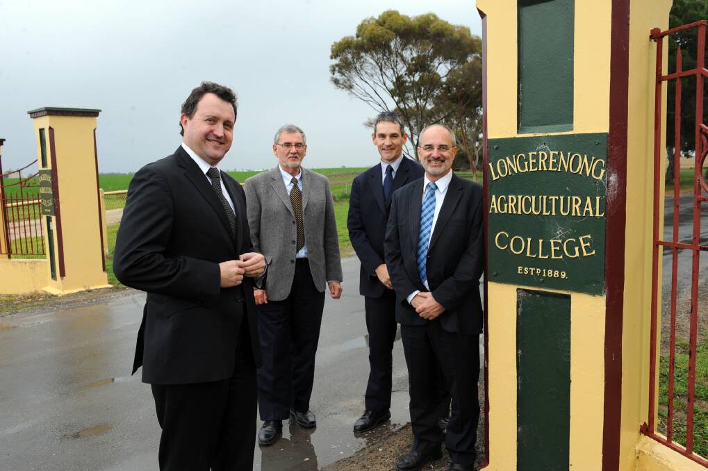 Bayer CropScience bioscience operations general manager Rob Hall, Bayer operations and project manager Peter Whitehouse, Longerenong College head of campus John Goldsmith and WorkCo chief executive John Ackland at the gate of Longerenong College, where a $14 million grains and oil seeds breeding site will be built. Picture: PAUL CARRACHER