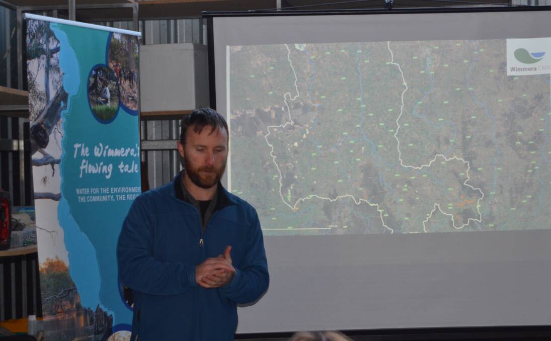 DATA: Wildlife ecologist Josh Griffiths showing historical data of the platypus in Wimmera waterways. Picture: ALISON FOLETTA.