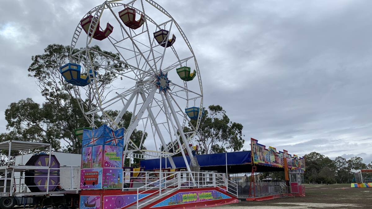 FUN TIMES: The Ferris Wheel being set up at Maydale Reserve. Picture: ALISON FOLETTA