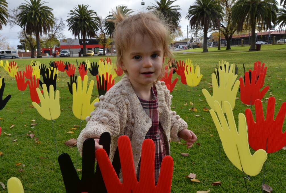 EMBRACE: Young Horsham resident Finley Davidson, 18 months, plants a hand. Picture: ALISON FOLETTA
