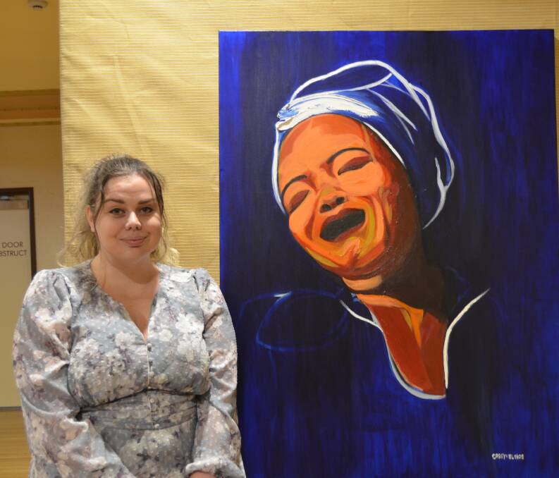 PASSION: Cassy Velinos with her piece inspired by Maya Angelou. Picture: ALISON FOLETTA.