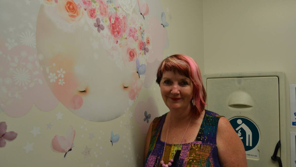 SAFE PLACE: Horsham Plaza manager Allison Roberts with the new wall decal in one of two parenting rooms. Picture: ALISON FOLETTA. 