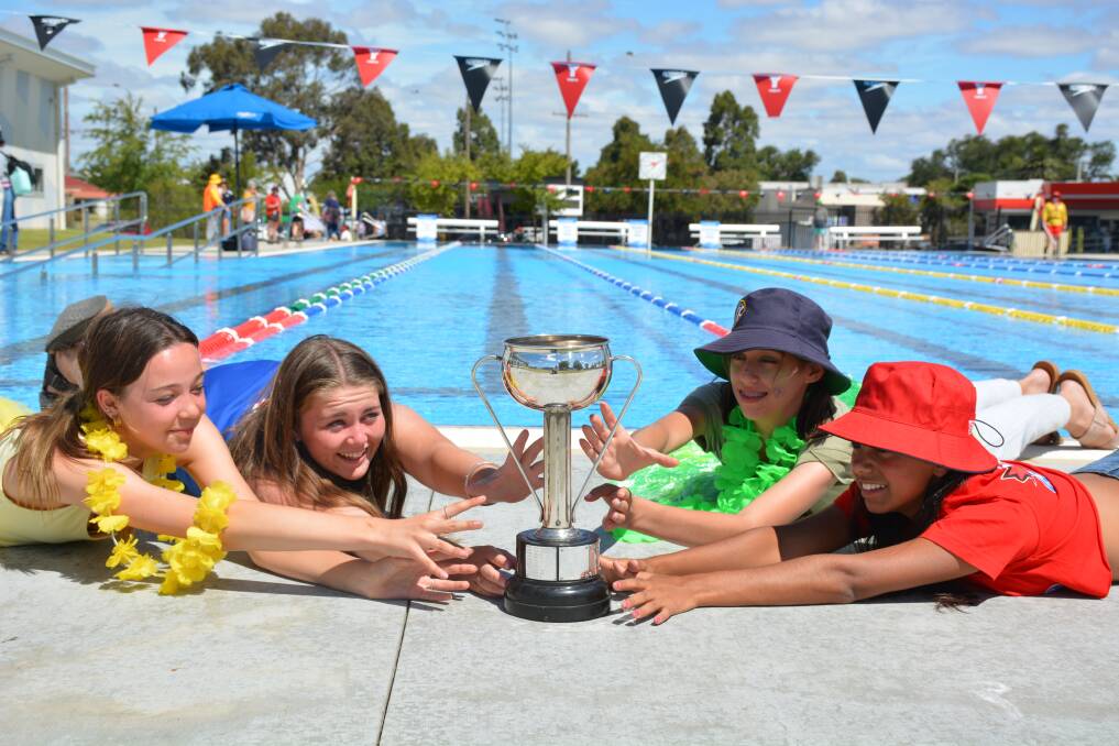 SPLIT DECISION: Students from each house fighting over the trophy: Alexis Richard McLachlan (left), Mjay Jones Darlot, Zoe Brennan Hall, Talani Braeside Briggs. Picture: CONTRIBUTED