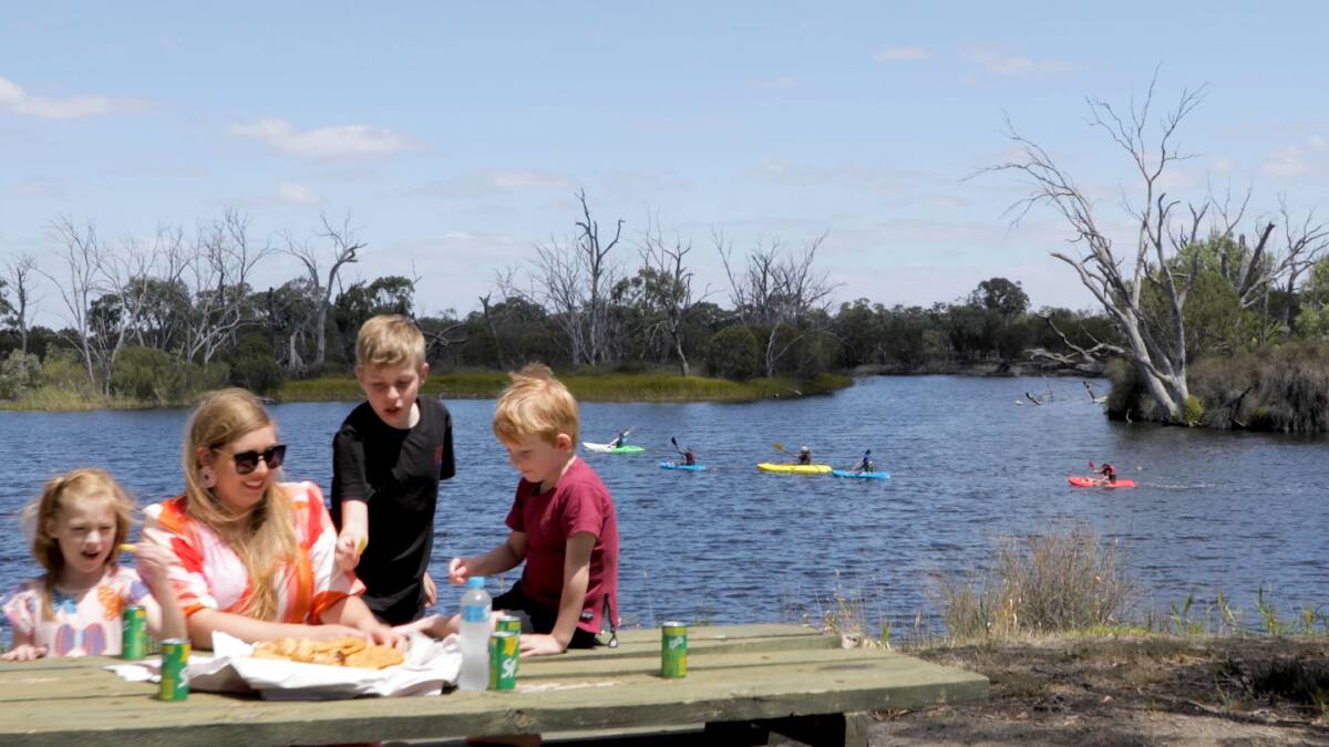 FISH AND CHIPS: Johanna Clark and her children Esme (left), Nathaniel and August enjoying fish and chips by the Wimmera River. Picture: CONTRIBUTED