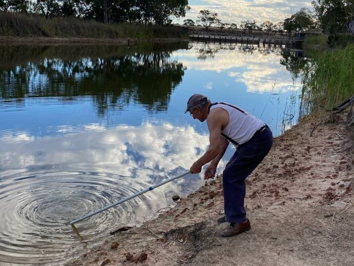 TESTING: Frank Pitt collecting water samples. Picture: CONTRIBUTED