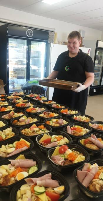 FOOD FOR THOUGHT: Participant Ben Isaac preparing meals to delivered. Picture: CONTRIBUTED