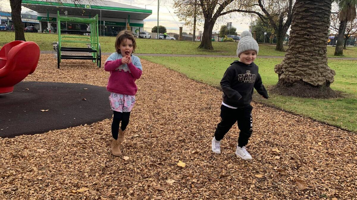 CHILLY: Sophie Lourensz and Zayden Taylor play at May Park. Picture: ALISON FOLETTA

