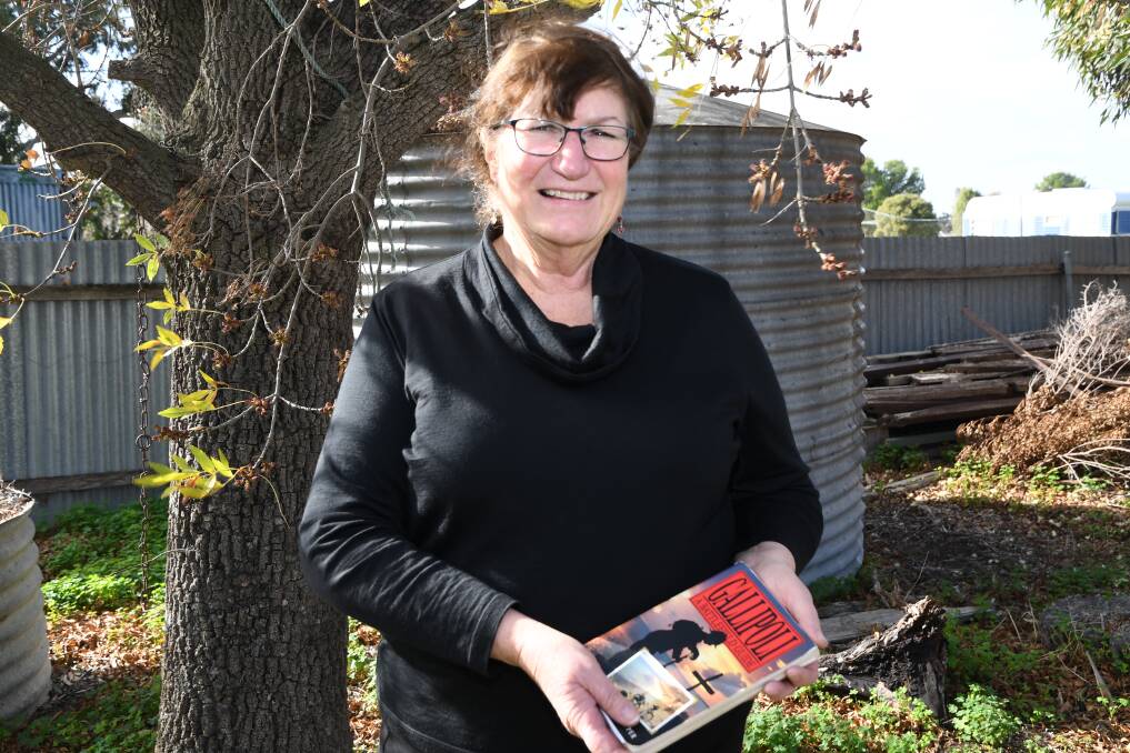 HISTORY: Pamela Cupper with Gallipoli: A Battlefield Guide, which she co-authored with her husband. Picture: ALEX DALZIEL