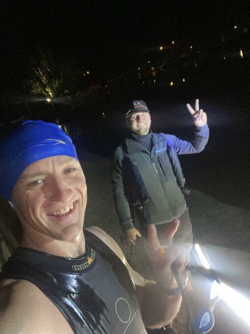 RIVER SWIM: Sam Anson (left), and his friend Chris Gulvin. Mr Gulvin paddled along side Mr Anson in a kayak to him swimming straight. Picture: CONTRIBUTED