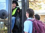 EARTHMOVING: Wim Resource's Jay Miller showing Donald High School students Sean Hogan and Hunter Winfield how an excavator works. 