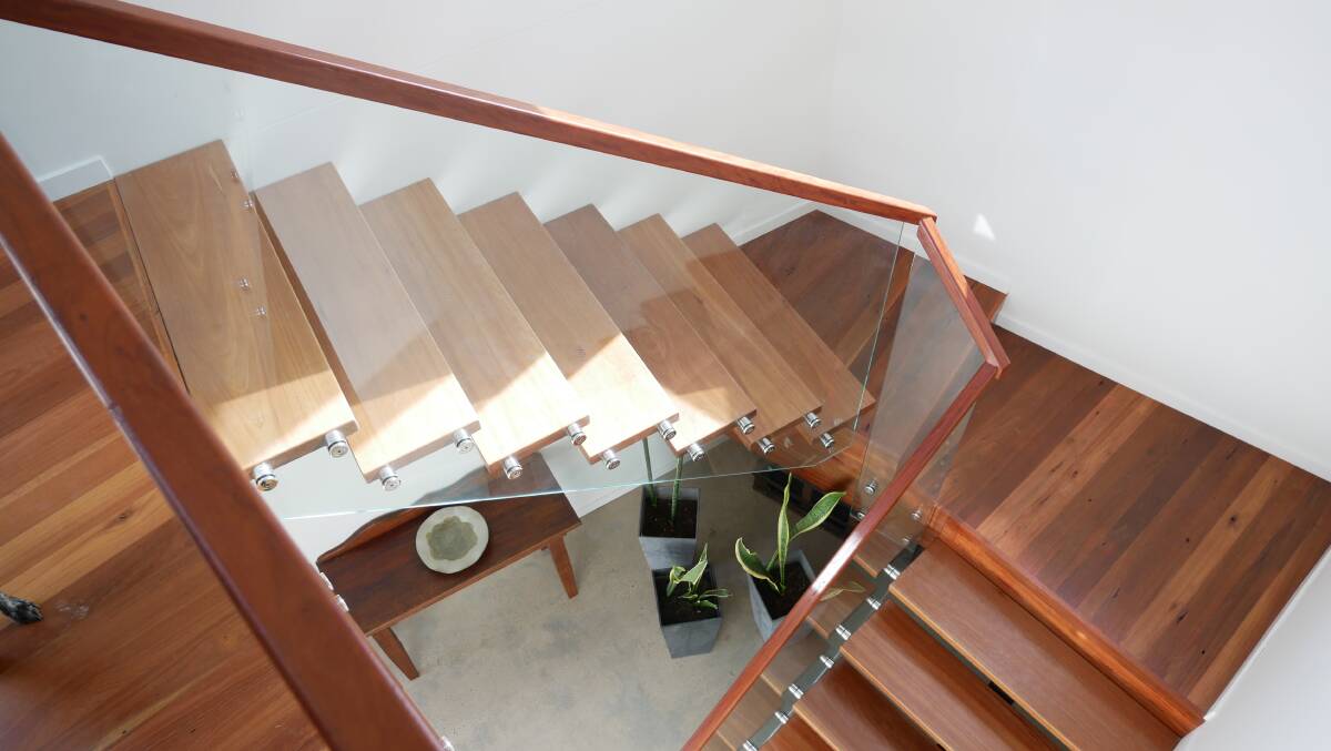 The floating staircase was difficult to build due to the different angles and fitting the treads into a confined space. The building codes also dictate that the rise and run and landings have to be a certain size. Photo: Ellouise Bailey 