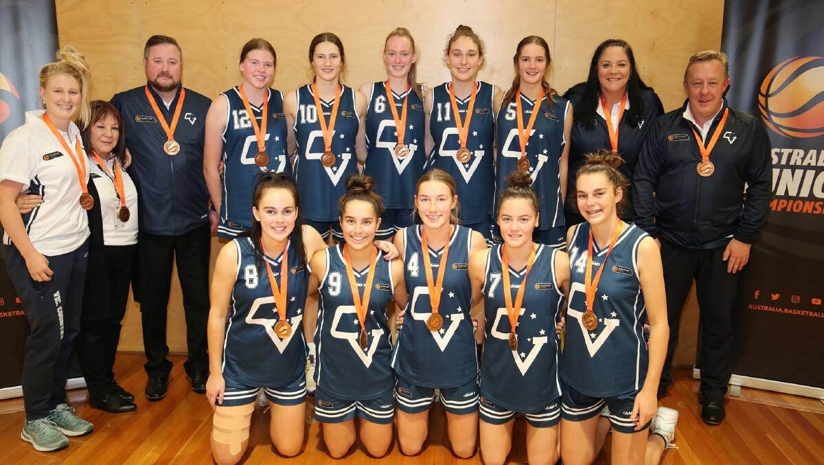 BRONZE: The under-18 Victoria Country women with assistant coach Ash McIntyre (back, second from the right) after finishing third. Picture: CONTRIBUTED