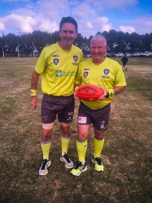 UNBELIEVABLE MILESTONE: AFL Wimmera Mallee umpire director Cameron Pickering (left) with Frank Marklew, just as Marklew was about to officiate his 900th football game in round five of the HDFNL. Picture: CONTRIBUTED
