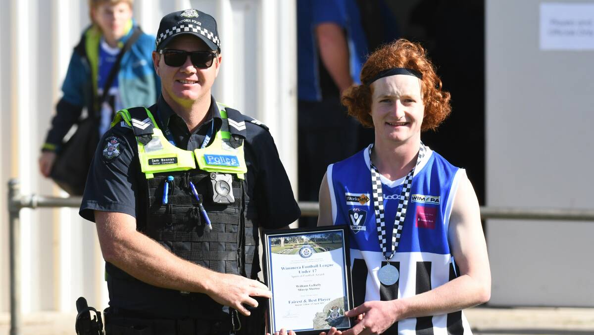 William Gellatly photographed receiving his award from Warracknabeal Police officer Senior Constable Sam Noonan.