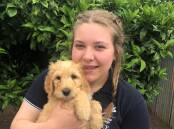 POOCH PERFECT: 2022 Murtoa College captain, Georgia Zolj, cuddles Rosie during their first meeting. Picture: CONTRIBUTED