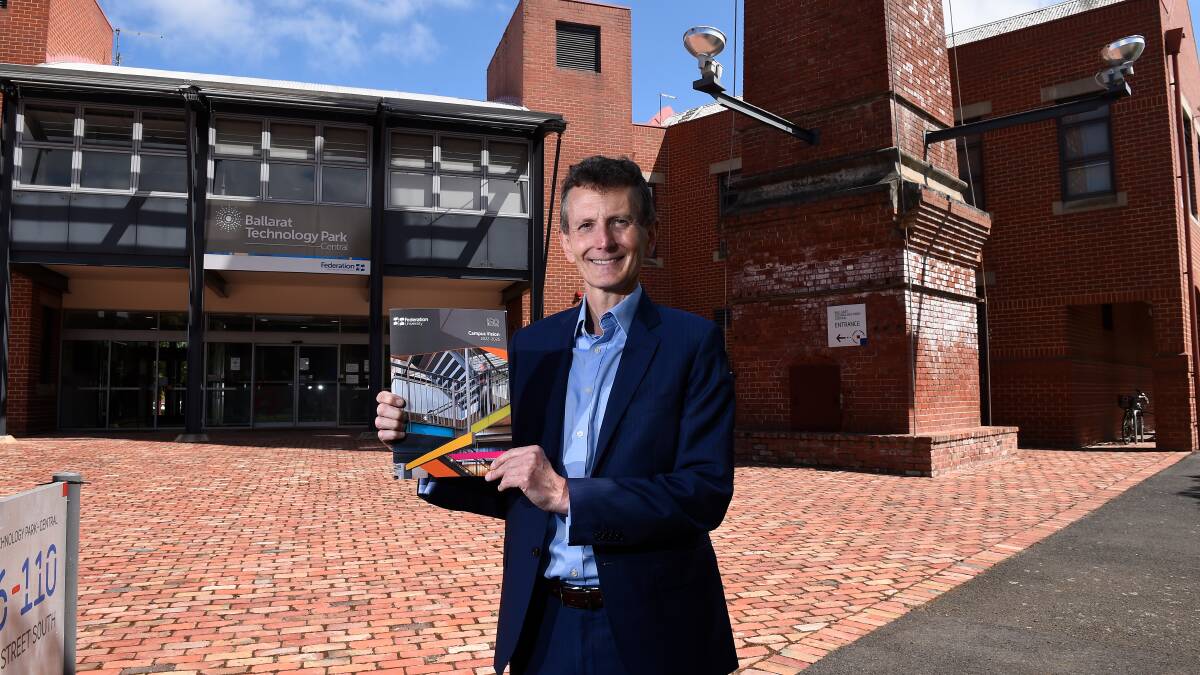 PLAN: Federation University Vice-Chancellor and President Professor Duncan Bentley holds a copy of the Campus Vision during the announcement on Wednesday. Picture: CONTRIBUTED