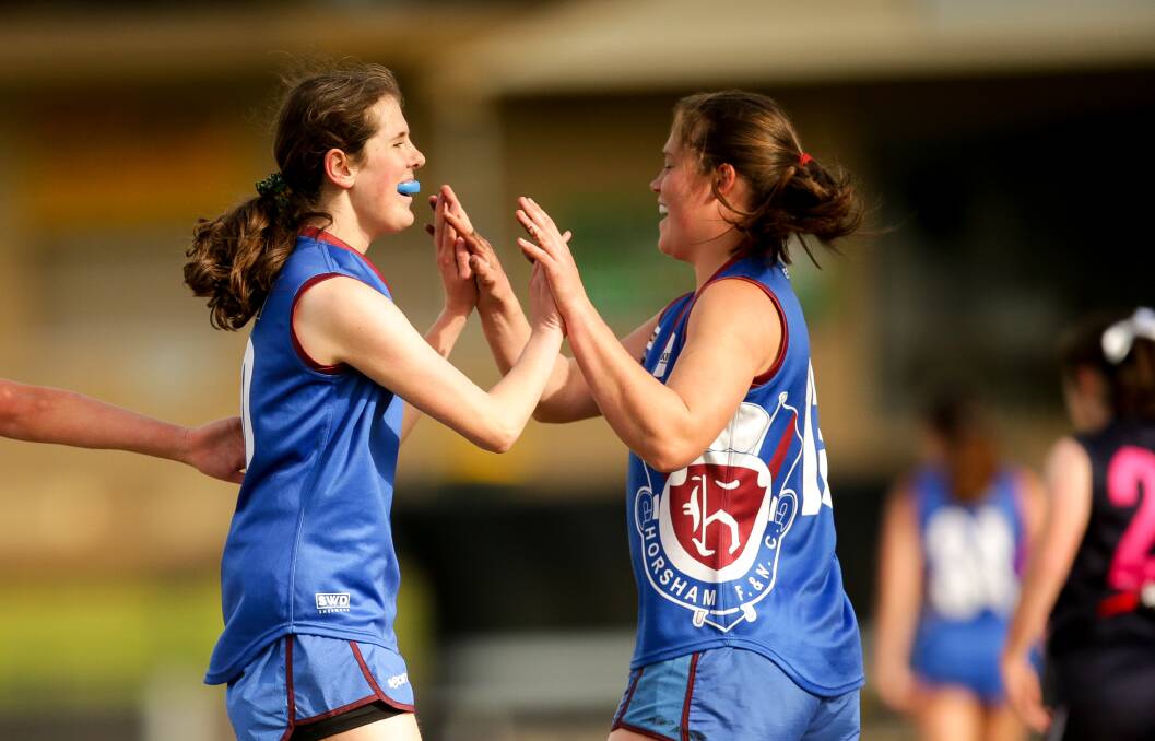 SCORE: The Demons U18 girls celebrate a goal against Warrnambool Blues during the season. Picture: CHRIS DOHENY
